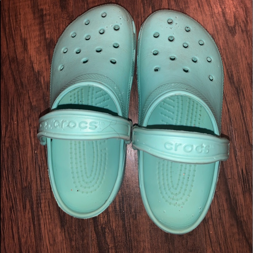 Torquise crocs .